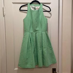 Green skater dress with open back
